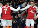 Mesut Ozil celebrates scoring with Alexis Sanchez during the Premier League game between Arsenal and Huddersfield Town on November 29, 2017