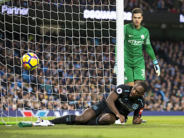 Michail Antonio fails to score as Ederson watches on during the Premier League game between Manchester City and West Ham United on December 3, 2017