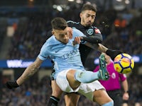 Nicolas Otamendi and Manuel Lanzini scrap it out during the Premier League game between Manchester City and West Ham United on December 3, 2017
