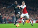 Romelu Lukaku and Aaron Ramsey in action during the Premier League game between Arsenal and Manchester United on December 2, 2017