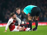 Shkodran Mustafi goes down injured during the Premier League game between Arsenal and Manchester United on December 2, 2017