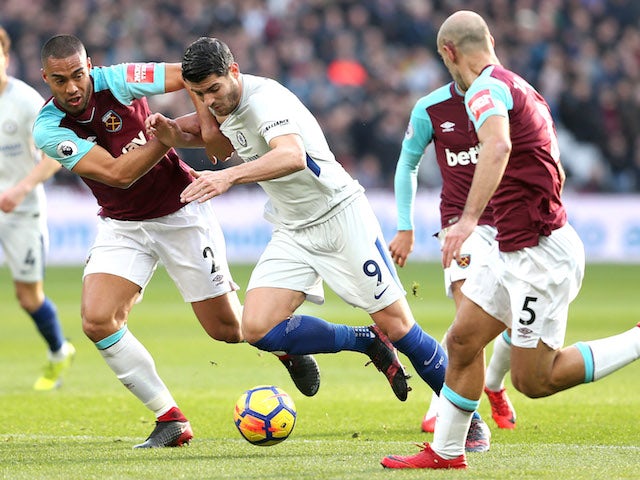 Alvaro Morata comes up against Winston Reid during the Premier League game between West Ham United and Chelsea on December 9, 2017