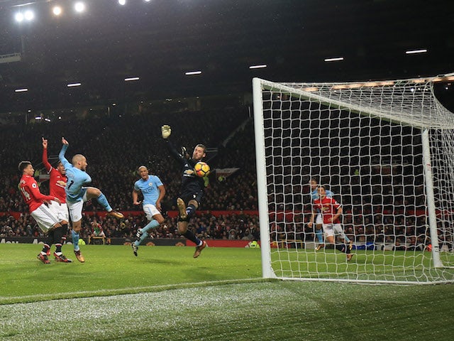 David Silva scores the opener during the Premier League game between Manchester United and Manchester City on December 10, 2017
