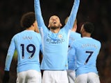 David Silva celebrates his opener during the Premier League game between Manchester United and Manchester City on December 10, 2017
