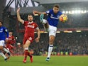 Dominic Calvert-Lewin and Jordan Henderson in action during the Premier League game between Liverpool and Everton on December 10, 2017