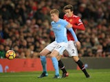 Kevin De Bruyne in action with Victor Lindelof during the Premier League game between Manchester United and Manchester City on December 10, 2017