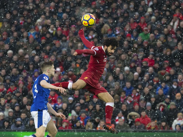 Mohamed Salah in action against Jonjoe Kenny during the Premier League game between Liverpool and Everton on December 10, 2017