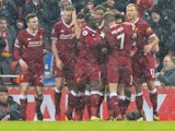 Mohamed Salah celebrates with teammates after scoring the opener during the Premier League game between Liverpool and Everton on December 10, 2017
