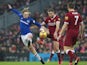 Tom Davies fights off an attack from Jordan Henderson during the Premier League game between Liverpool and Everton on December 10, 2017