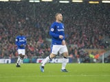Snow is falling, all around Wayne Rooney during the Premier League game between Liverpool and Everton on December 10, 2017
