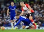 Eden Hazard goes down under Oriol Romeu during the Premier League game between Chelsea and Southampton on December 16, 2017