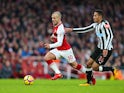 Jack Wilshere and Isaac Hayden in action during the Premier League game between Arsenal and Newcastle United on December 16, 2017
