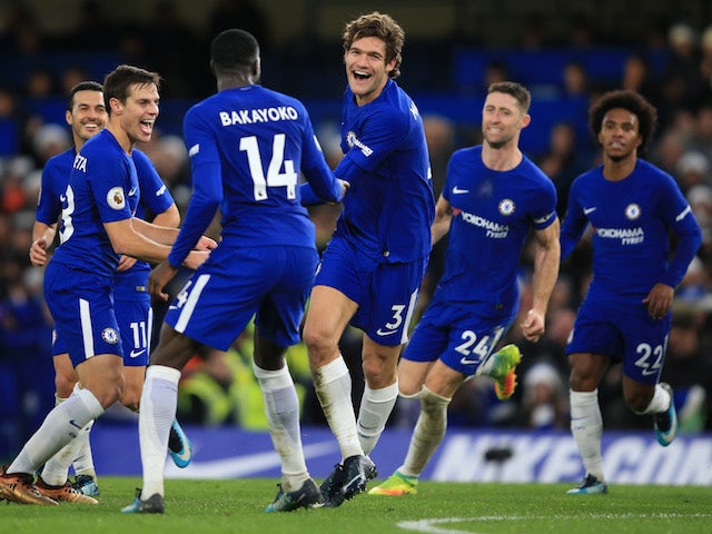Marcos Alonso celebrates with teammates after scoring during the Premier League game between Chelsea and Southampton on December 16, 2017