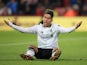 Roberto Firmino reacts to a foul during the Premier League game between Bournemouth and Liverpool on December 17, 2017