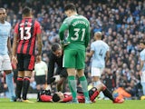 Junior Stanislas of Bournemouth goes off injured during the Premier League match against Manchester City on December 23, 2017