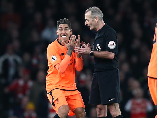 Roberto Firmino protesteth during the Premier League game between Arsenal and Liverpool on December 22, 2017