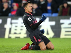 Sanchez brace fires Arsenal past Palace