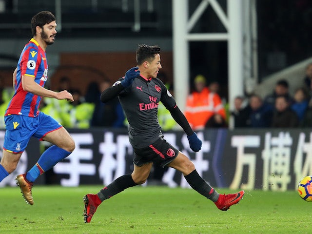 Alexis Sanchez scores the Gunners' third during the Premier League game between Crystal Palace and Arsenal on December 28, 2017