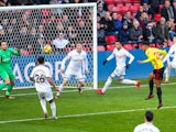 Andre Carrillo scores the opener during the Premier League game between Watford and Swansea City on December 30, 2017