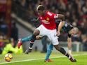 Paul Pogba and Oriol Romeu in action during the Premier League game between Manchester United and Southampton on December 30, 2017