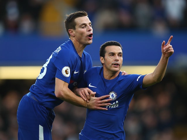 Pedro celebrates with Cesar Azpilicueta after scoring the third during the Premier League game between Chelsea and Stoke City on December 30, 2017