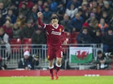 Philippe Coutinho celebrates scoring the opener during the Premier League game between Liverpool and Swansea City on December 26, 2017