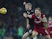 Ragnar Klavan takes on a terrified Oliver McBurnie during the Premier League game between Liverpool and Swansea City on December 26, 2017
