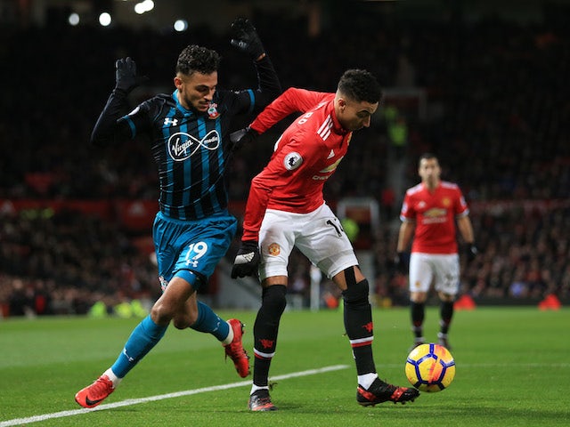 Sofiane Boufal and Jesse Lingard in action during the Premier League game between Manchester United and Southampton on December 30, 2017