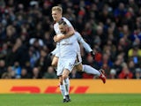 Steven Defour celebrates with Ben Mee after scoring during the Premier League game between Manchester United and Burnley on December 26, 2017