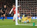 Thibaut Courtois thwarts Mesut Ozil after Alexis Sanchez's rebound during the Premier League game between Arsenal and Chelsea on January 3, 2018