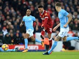 Alex Oxlade-Chamberlain scores the opener during the Premier League game between Liverpool and Manchester City on January 14, 2018