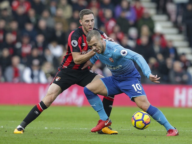Dan Gosling and Jack Wilshere in action during the Premier League game between Bournemouth and Arsenal on January 14, 2018
