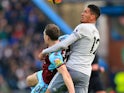 Ashley Barnes grapples with Chris Smalling during the Premier League game between Burnley and Manchester United on January 20, 2018