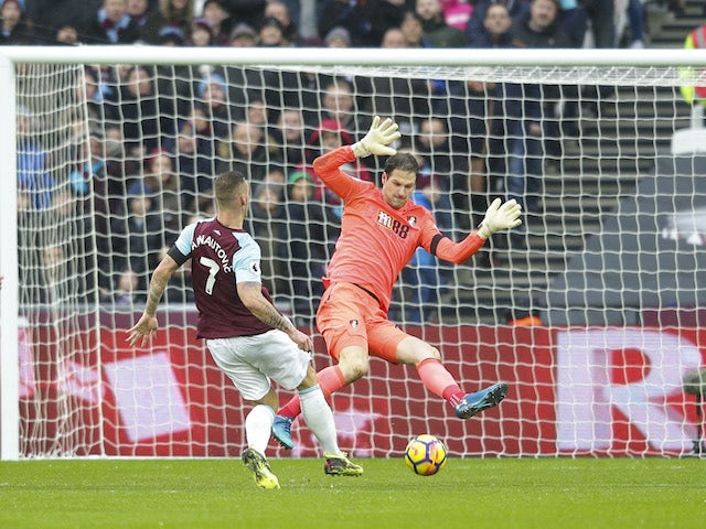 Asmir Begovic saves a shot from Marko Arnautovic during the Premier League game between West Ham United and Bournemouth on January 20, 2018