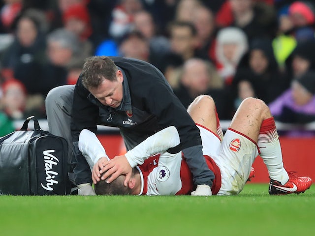Jack Wilshere goes down with an injury to his head during the Premier League game between Arsenal and Crystal Palace on January 20, 2018