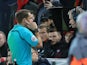 Referee Craig Pawson checks VAR during the FA Cup fourth round clash between Liverpool and West Bromwich Albion at Anfield on January 27, 2018