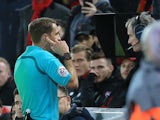 Referee Craig Pawson checks VAR during the FA Cup fourth round clash between Liverpool and West Bromwich Albion at Anfield on January 27, 2018