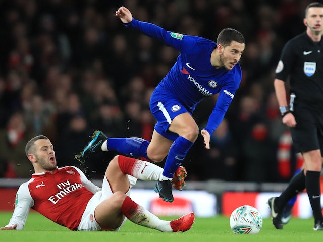 Jack Wilshere tackles Eden Hazard during the EFL Cup semi-final second leg between Arsenal and Chelsea at the Emirates Stadium on January 24, 2018