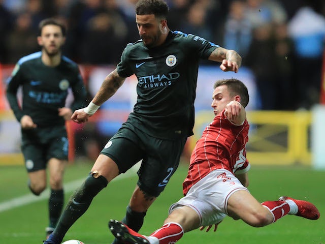 Kyle Walker and Joe Bryan in action during the EFL Cup game between Bristol City and Manchester City on January 23, 2018