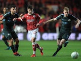 Liam Walsh, Sergio Aguero and Kevin De Bruyne in action during the EFL Cup game between Bristol City and Manchester City on January 23, 2018