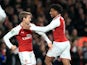 Arsenal pair Nacho Monreal and Alex Iwobi celebrate during their side's EFL Cup semi-final with Chelsea at the Emirates Stadium on January 24, 2018