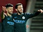 Sergio Aguero celebrates with Bernardo Silva after scoring during the EFL Cup game between Bristol City and Manchester City on January 23, 2018