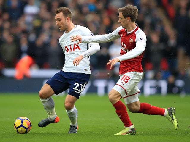Christian Eriksen and Nacho Monreal in action during the Premier League game between Tottenham Hotspur and Arsenal on February 10, 2018