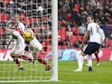 Harry Kane scores the opener during the Premier League game between Tottenham Hotspur and Arsenal on February 10, 2018