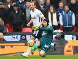 Petr Cech keeps out Harry Kane during the Premier League game between Tottenham Hotspur and Arsenal on February 10, 2018