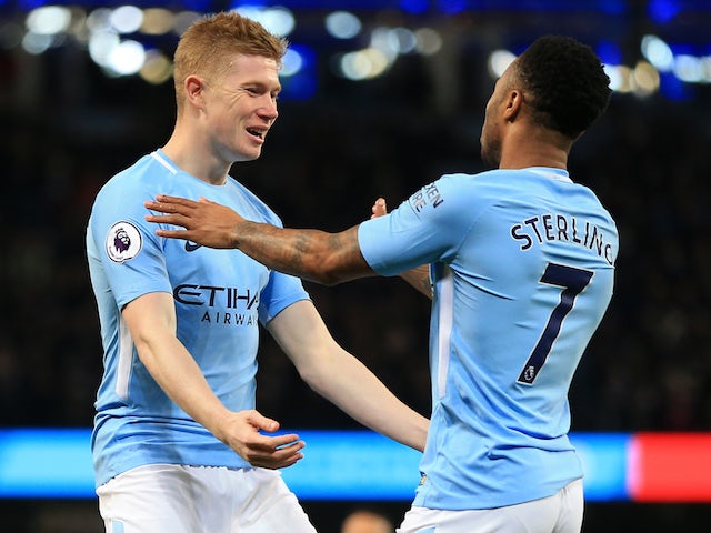 Raheem Sterling celebrates with Kevin De Bruyne during the Premier League game between Manchester City and Leicester City on February 10, 2018
