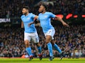 Raheem Sterling celebrates with Sergio Aguero after scoring during the Premier League game between Manchester City and Leicester City on February 10, 2018