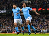 Raheem Sterling celebrates with Sergio Aguero after scoring during the Premier League game between Manchester City and Leicester City on February 10, 2018