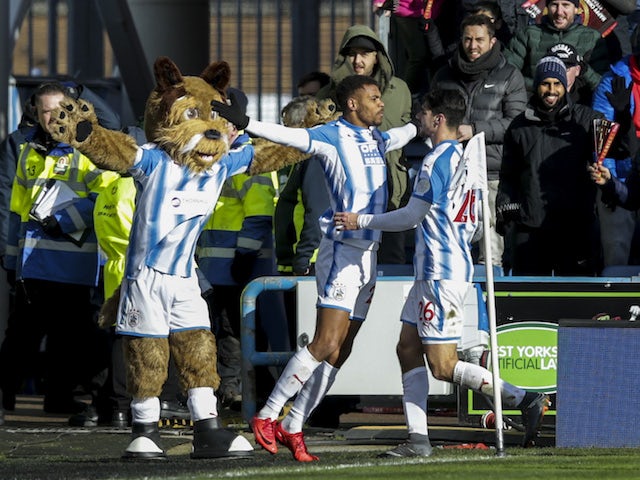 Steve Mounie celebrates getting the Terriers' second during the Premier League game between Huddersfield Town and Bournemouth on February 11, 2018