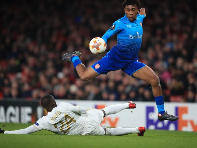 Alex Iwobi of Arsenal in action with Ronald Mukiibi of Ostersunds FK in the Europa League on February 22, 2018